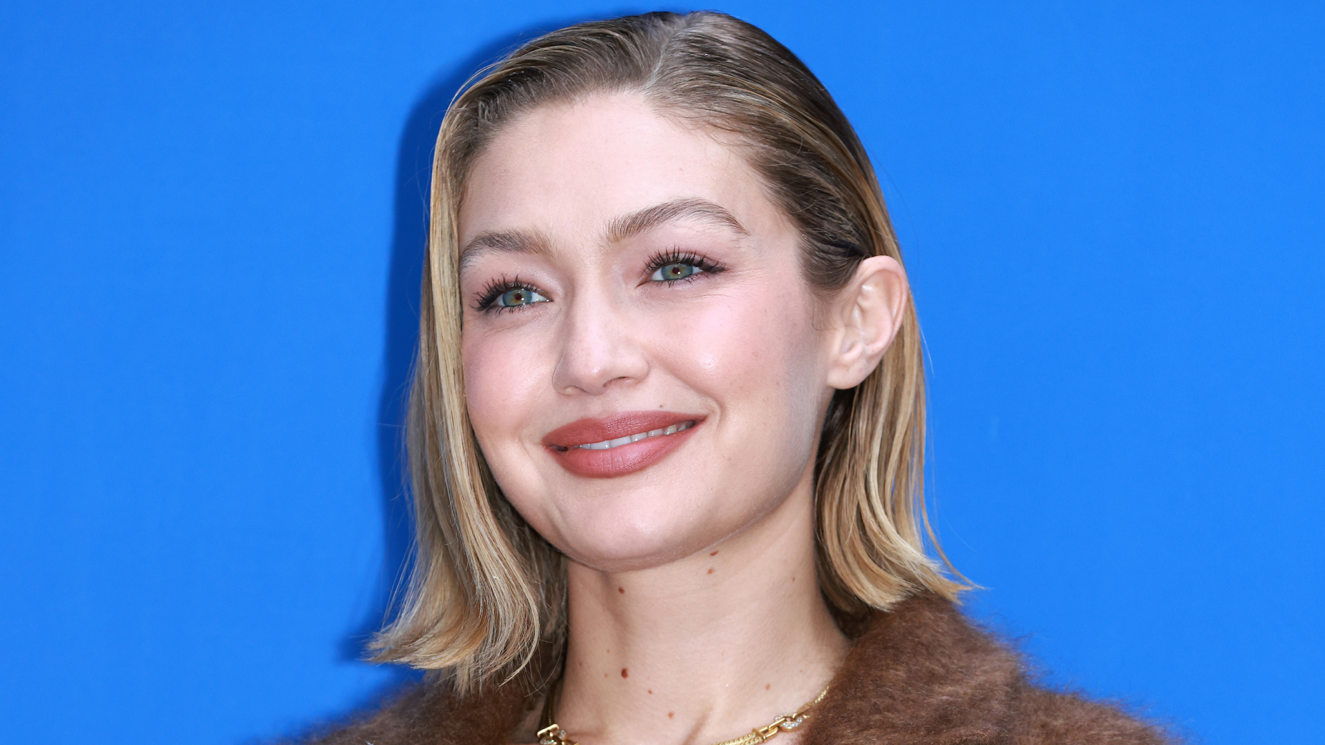 Gigi Hadid in a bob haircut smiling.