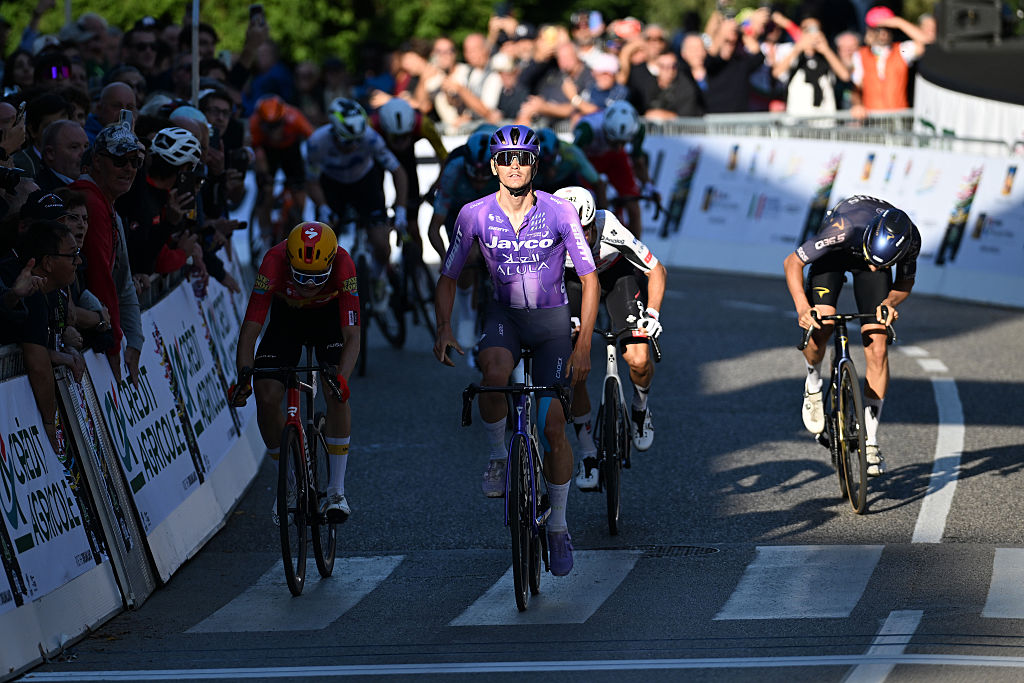 VINCENZA, ITALY - OCTOBER 14: Alessandro Covi of Italy and Team Jayco AlUla celebrates at finish line as race winner ahead of (L-R) Anthon Charmig of Denmark and Team Uno-X Mobility and Fabio Christen of Switzerland and Team Pinarello Q36.5 Pro Cycling Team during the 89th Giro del Veneto 2026 a 167km one day race from Verona to Vicenza on October 14, 2026 in Vicenza, Italy. (Photo by Tim de Waele/Getty Images)