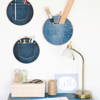 DIY jean embroidery hoops holding tools and pencils