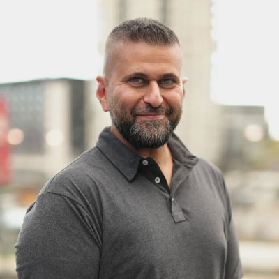 headshot of renewables expert Michael Zohouri 