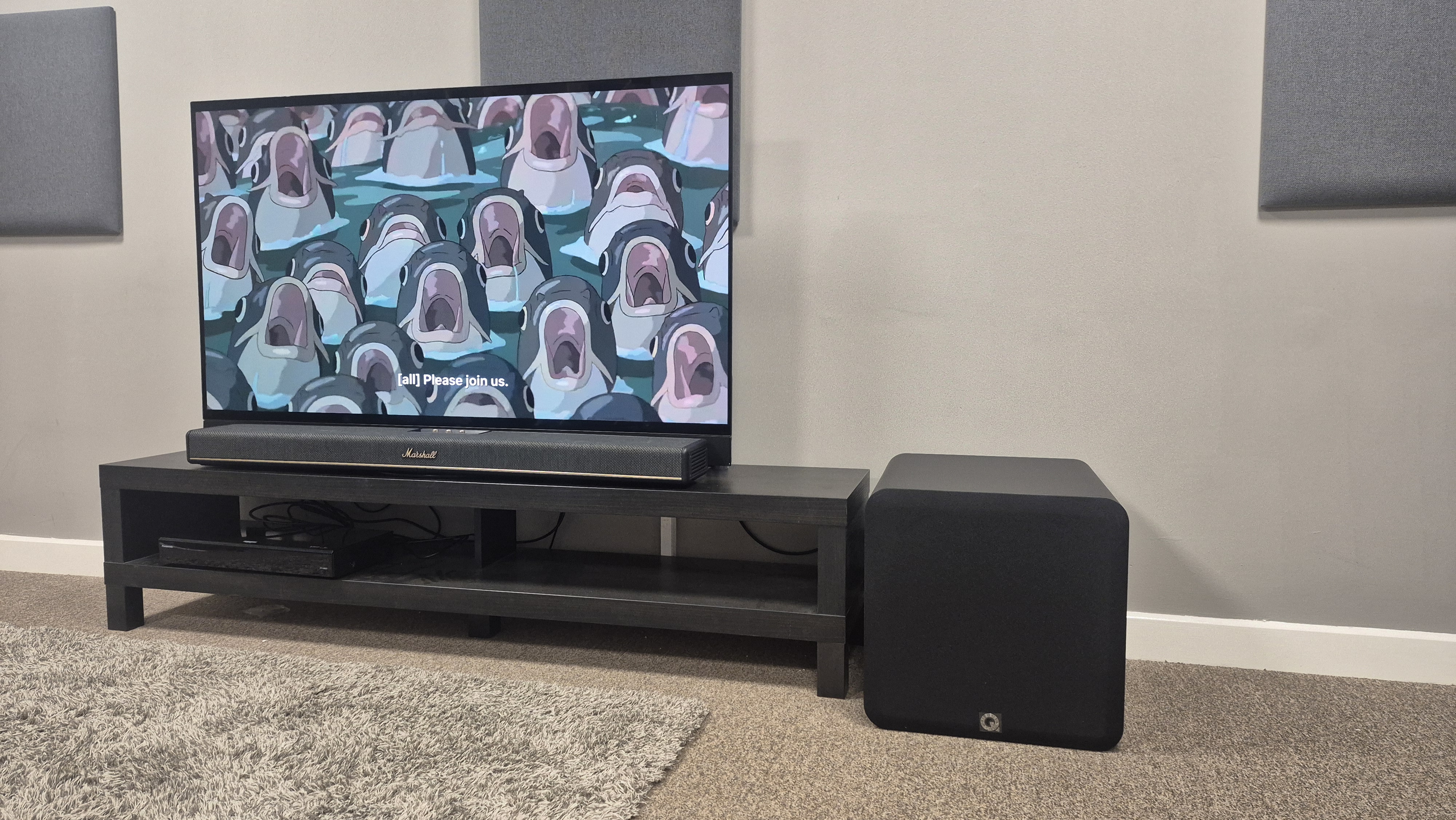 Q Acoustics Q Sub120 next to Marshall Heston 120 with TV playing The Boy and the Heron
