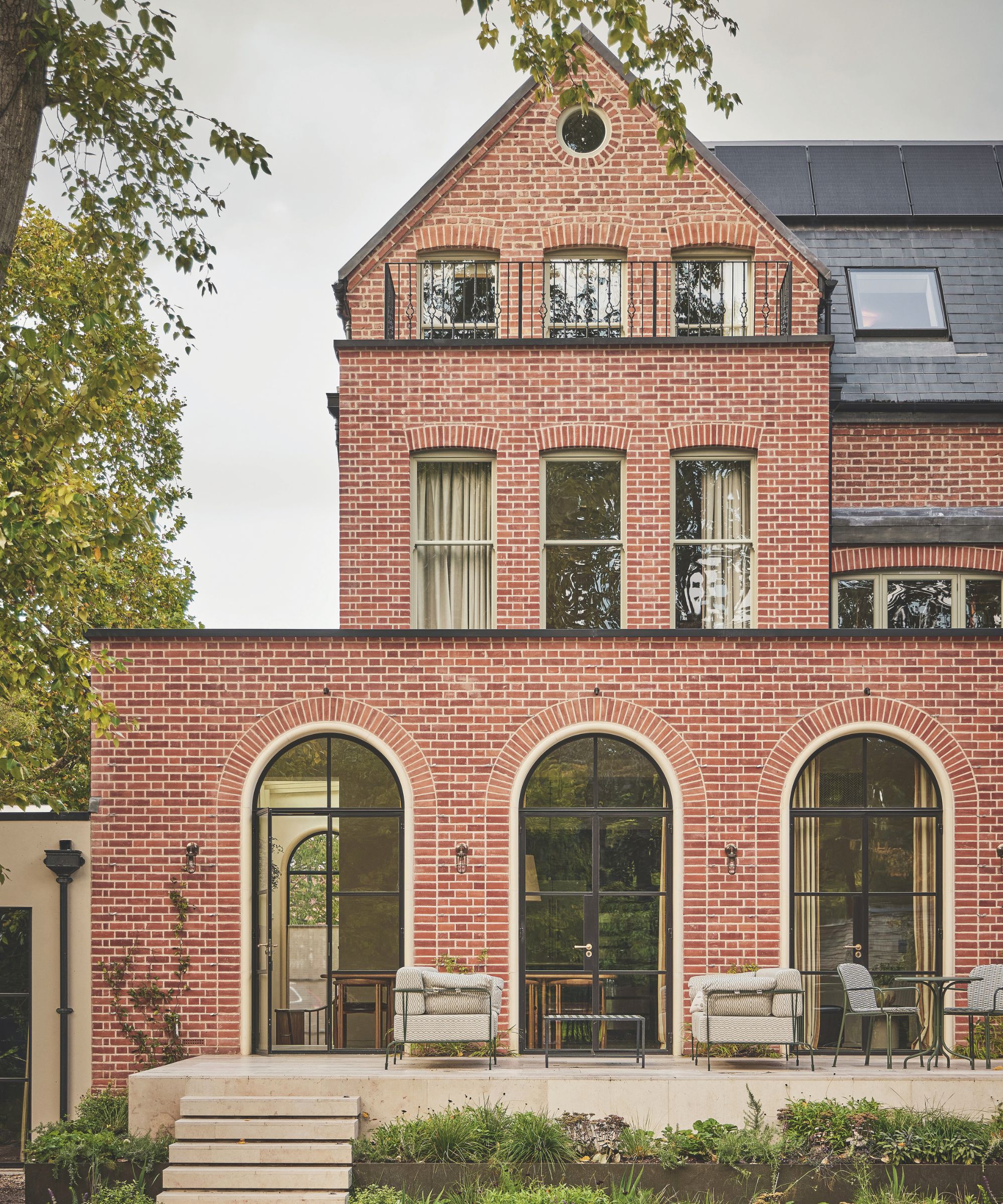 Exterior of a large red brick home
