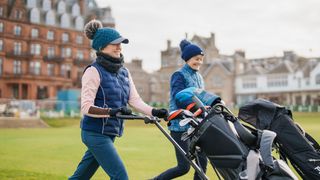 katie dawkins walking off the first tee with alison root old course st andrews