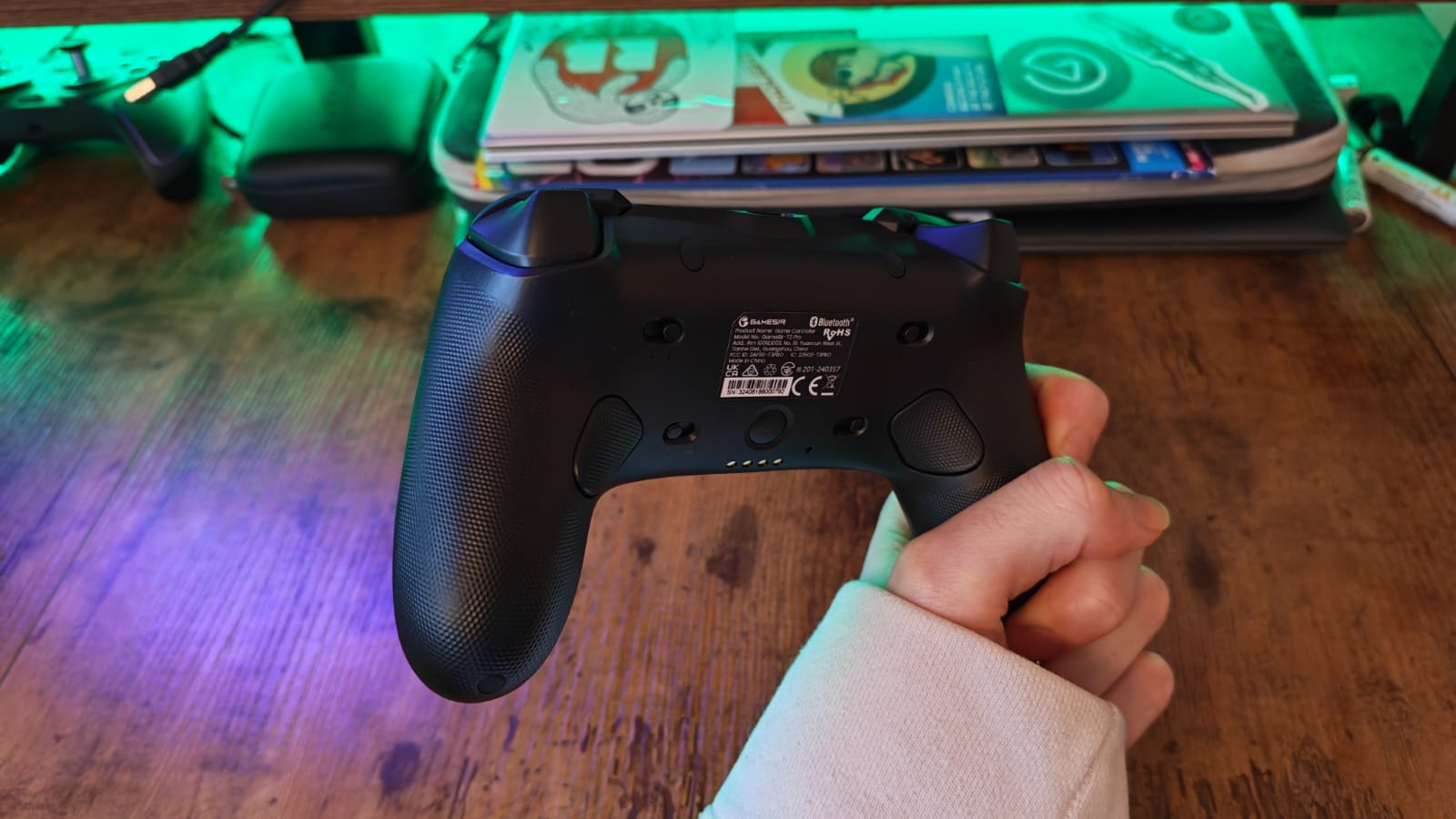 The back of the GameSir Tarantula Pro being held by a reviewer