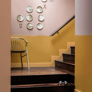 pink and gold wall wooden stairway and wall pieces