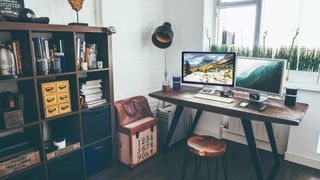 two monitors on a desk in a home office