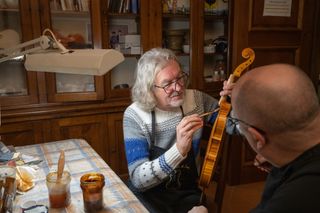 James May helps restore a violin.
