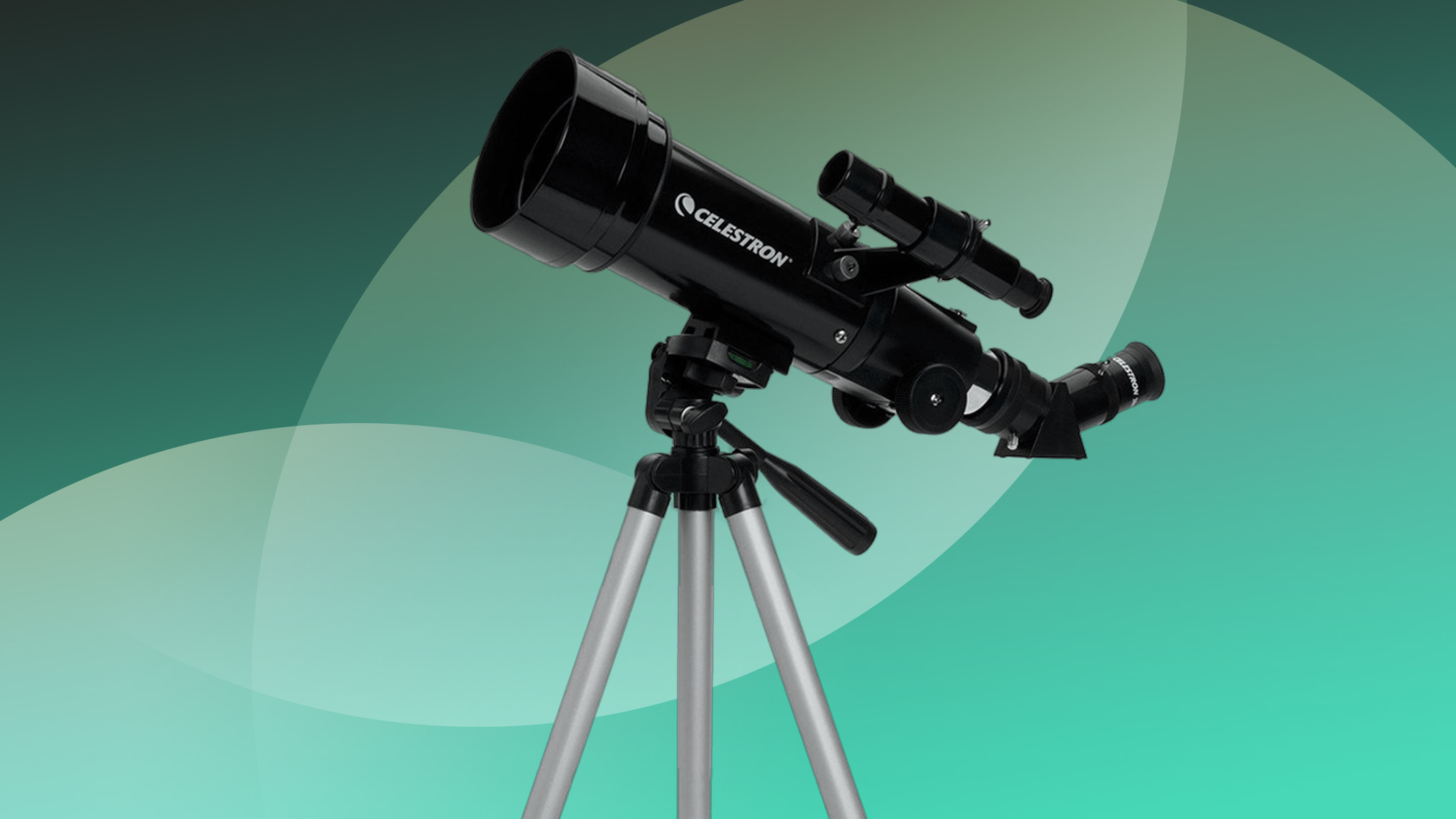 Celestron 70mm travel scope on a green background