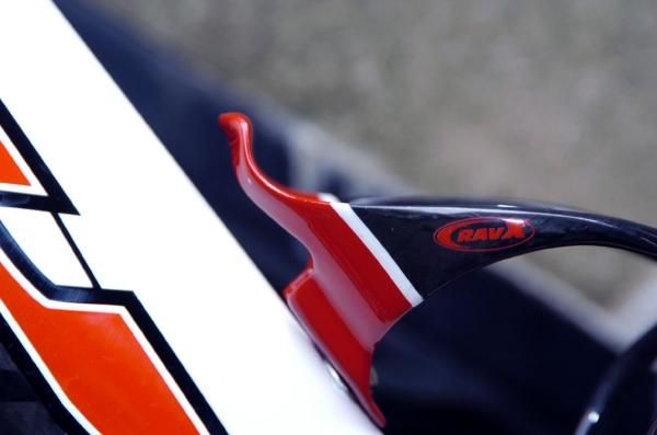 The small lip at the top of the Beta X cage keeps the bottle in place without interfering with the placement of removal of the bottle