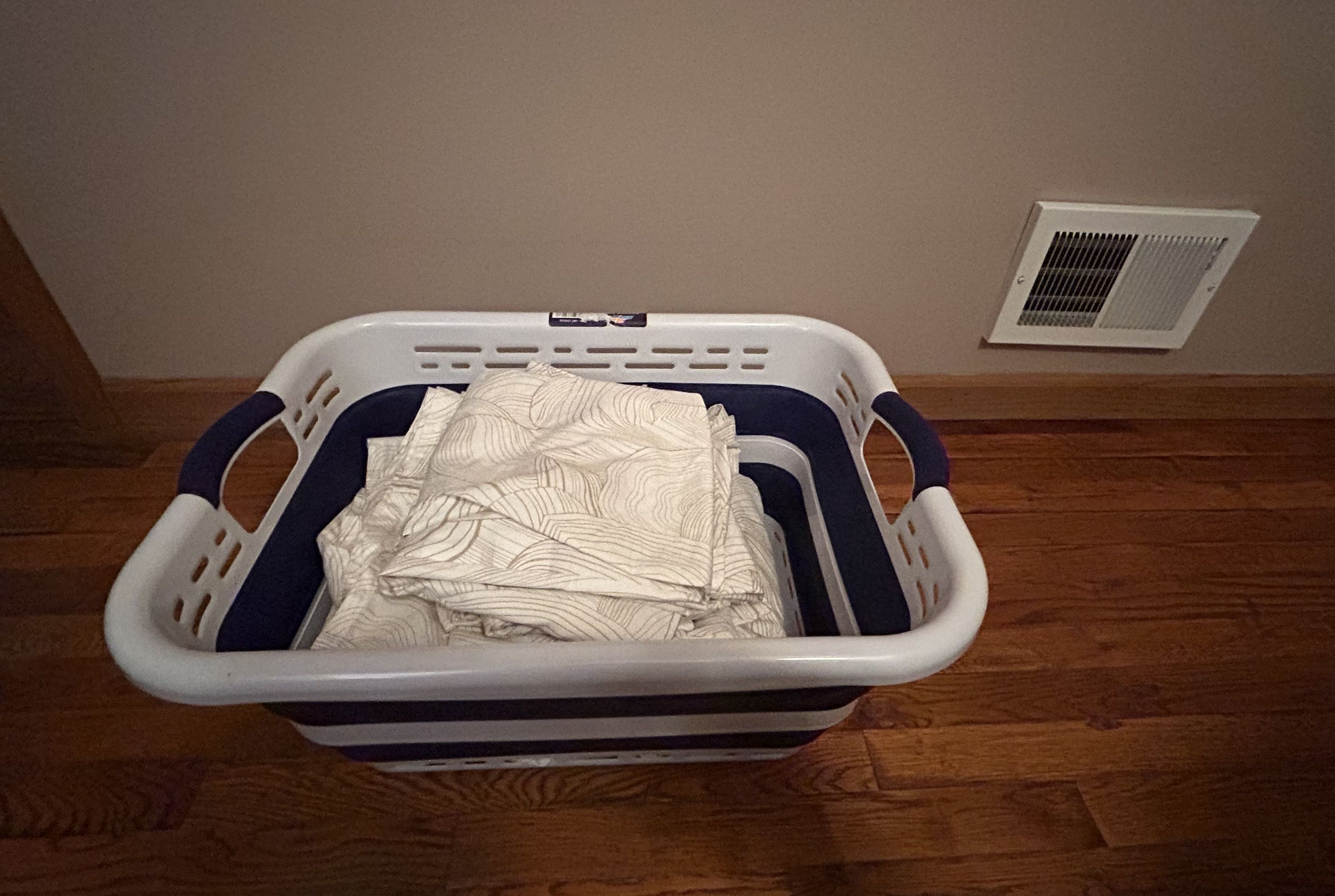 Brooklinen Luxe Sateen Core Sheet set folded in the laundry basket