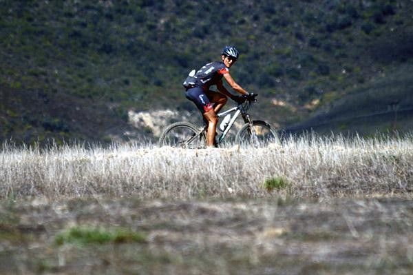 Myriam Saugy rides an open section of the Cape Epic course, which changes every year.