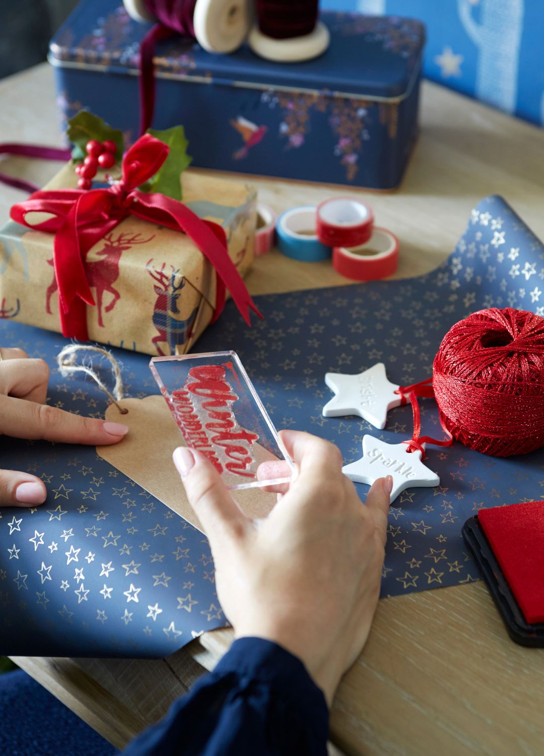 picture of person wrapping christmas presents