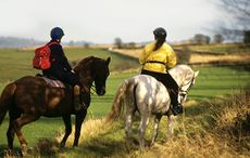 people on a hack , hacking fields in background