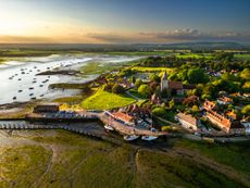 Chichester Harbour — especially villages such as Bosham — commands a serious house price premium.