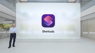 Craig Federighi stands in front of the Shortcuts app icon
