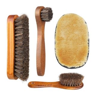 A variety of different soft bristle brushes against a white background