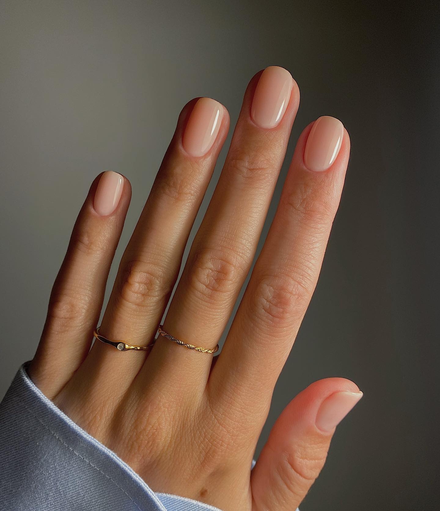 Neutral peach nail color.