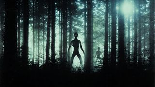 An artist's rendering of menacing alien monsters standing in a forest