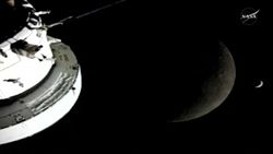 Artemis 2 beyond the moon with crescent