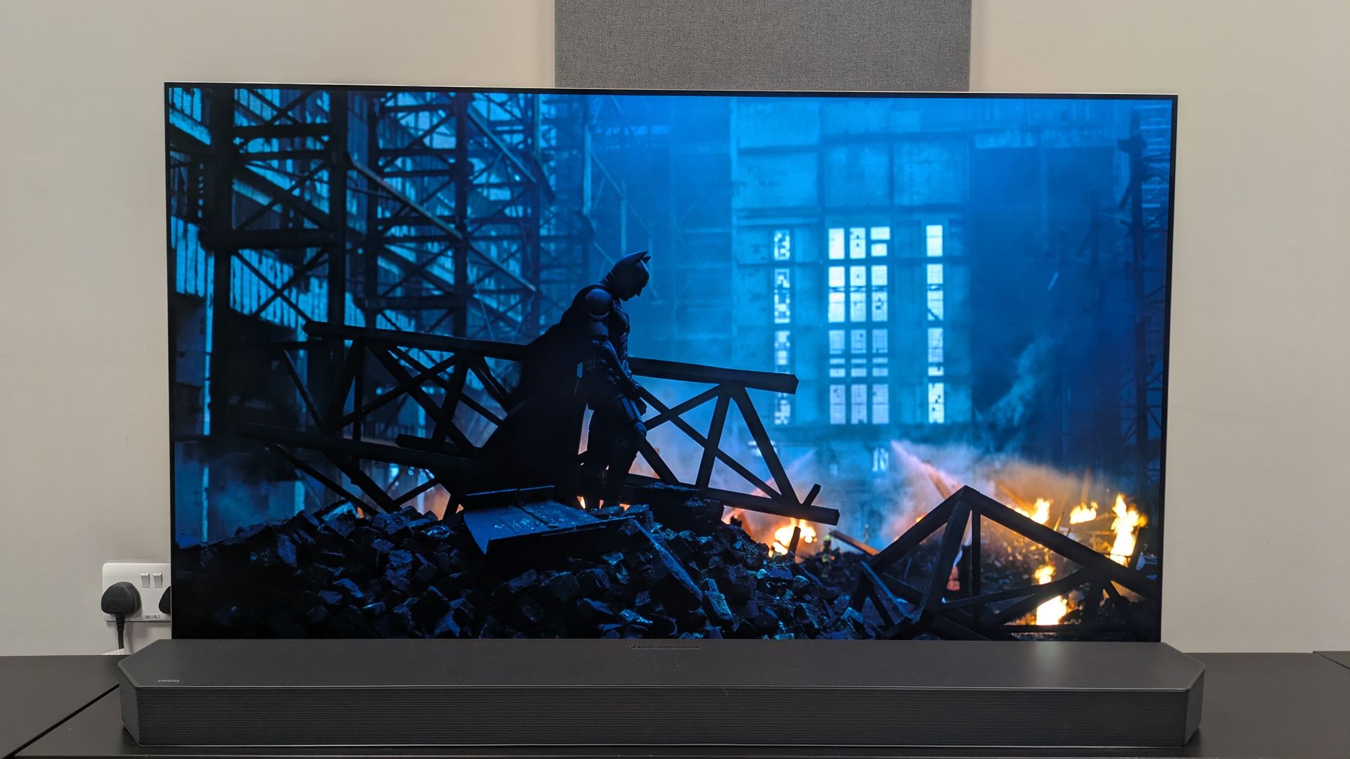 The Dark Knight 4K Blu-ray on LG G6, showing IMAX scene of Batman stood in wreckage.