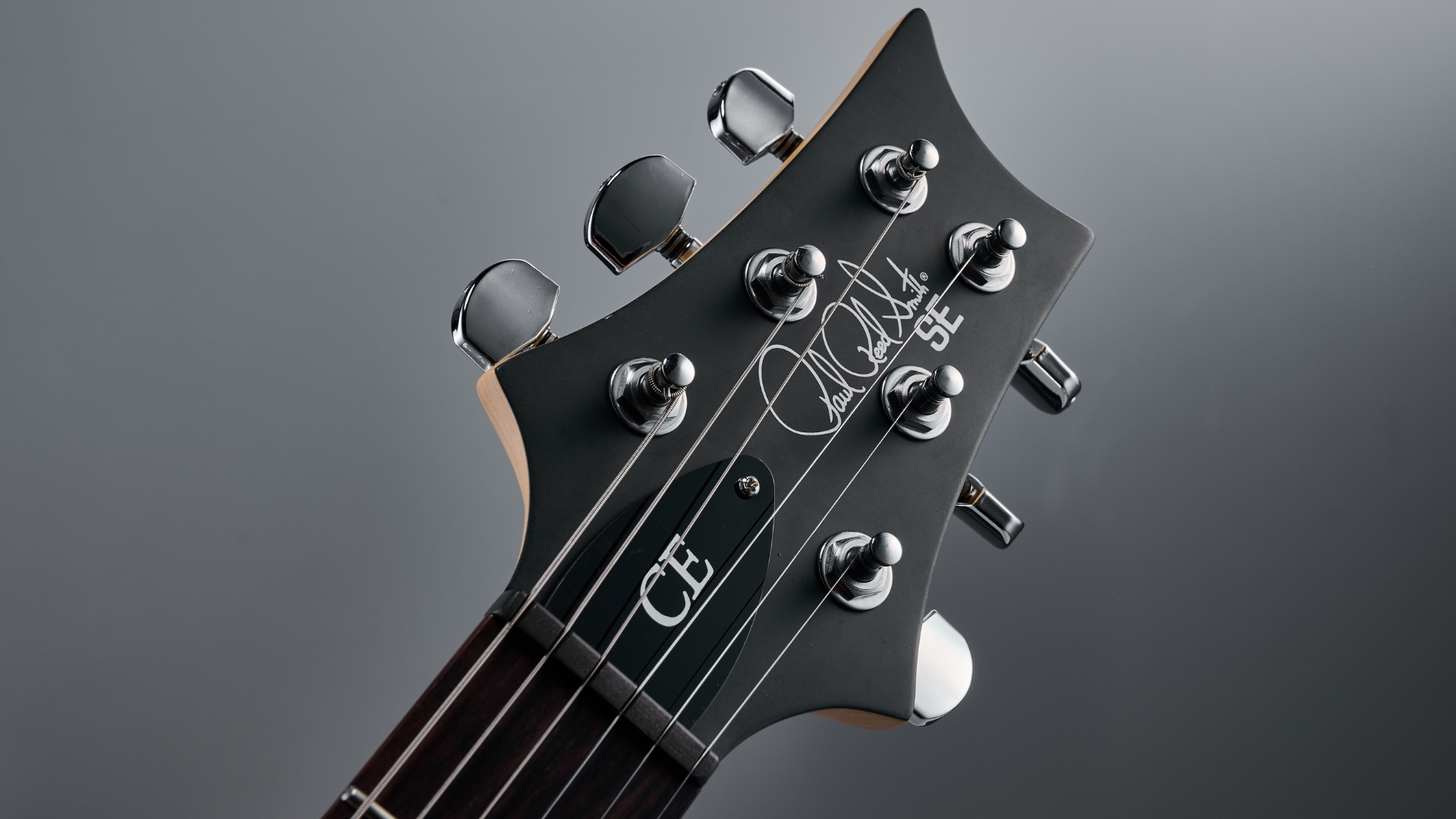 Close up of the headstock on a PRS SE CE 24 Standard Satin electric guitar