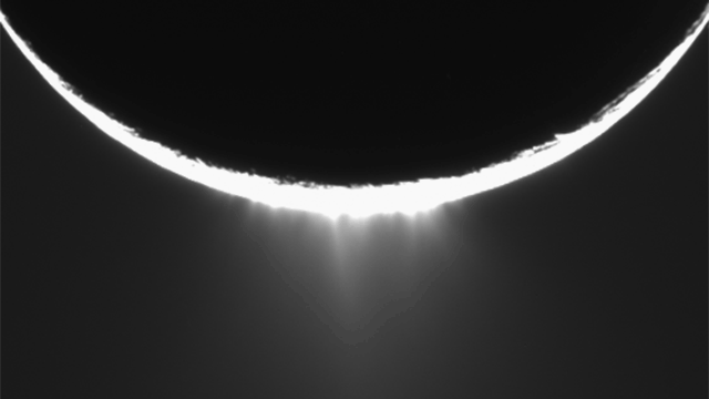 Plumes of water ice erupt from the surface of Saturn's moon Enceladus. Image taken by the Cassini probe in November 2005.