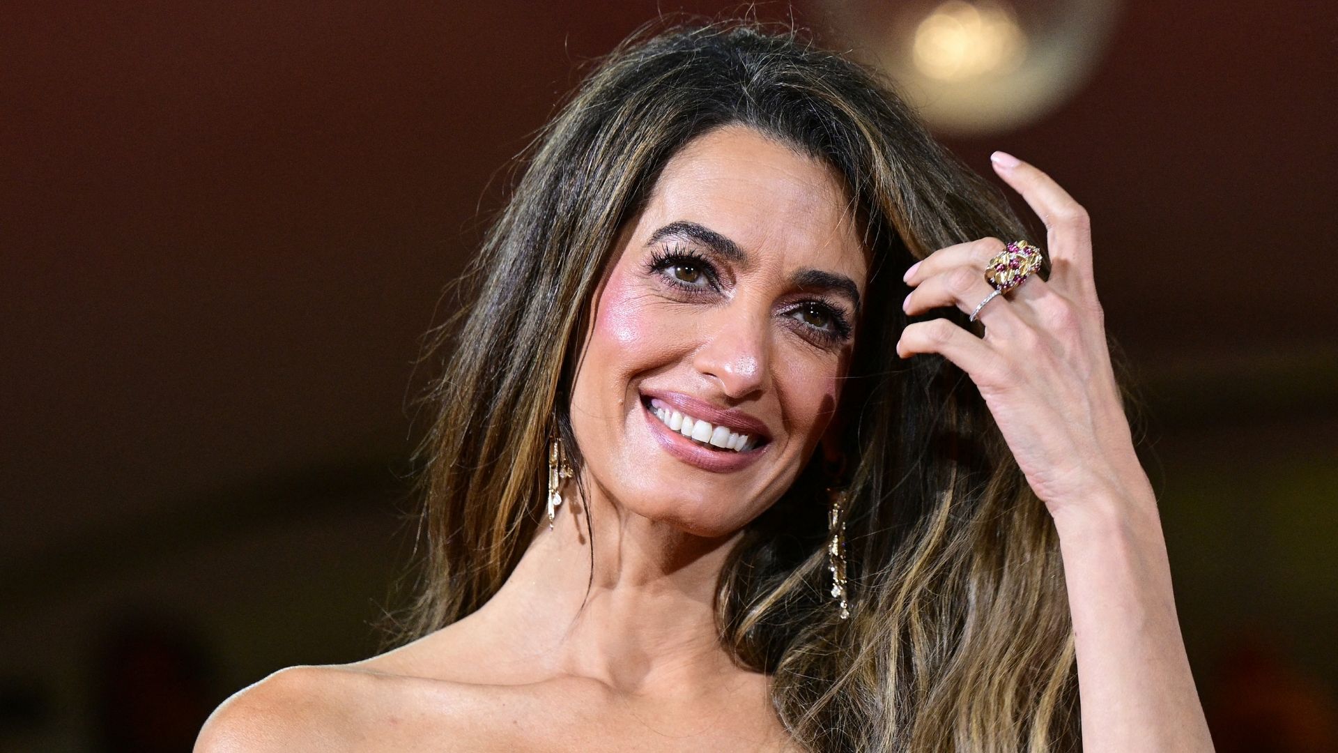 The humidity-proof £9 L'Oréal buy behind Amal Clooney's 70s-inspired 'bell bottom' haircut