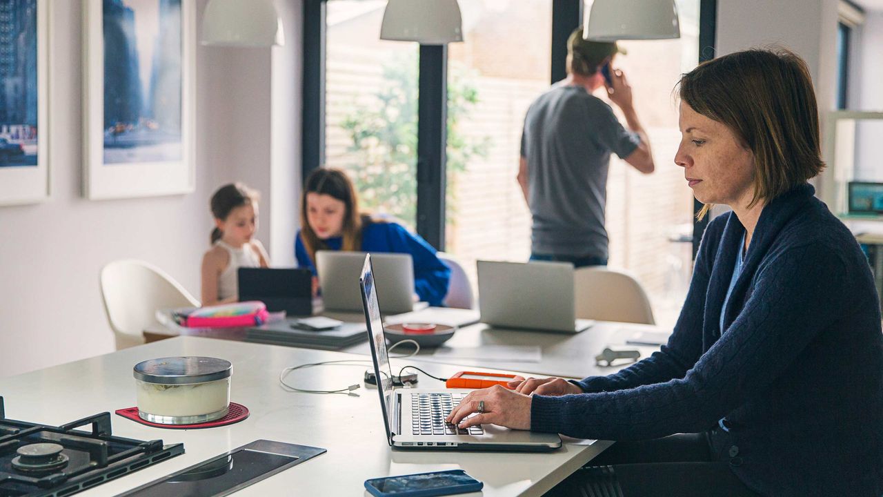 Parents working from home with two daughters