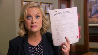 Leslie Knope (Amy Poehler) with loyalty contract in Parks and Recreation