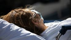 A COVID-19 patient arrives to the Montefiore Medical Center Moses Campus on April 07, 2020, in the Bronx borough of New York City. 