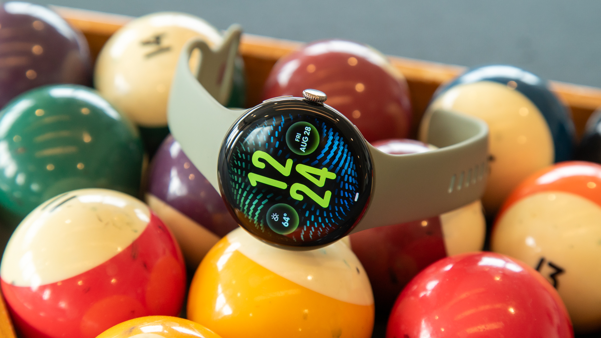 The Pixel Watch 5 on a stack of billiard balls