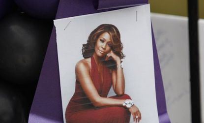 A tribute hangs outside The New Hope Baptist Church in Newark: Whitney Houston's February funeral set Newark residents back $187,000.