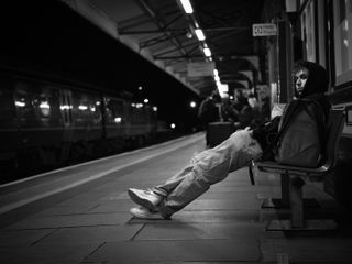 Hasselblad XCD 75P sample image of young man sitting on a bench on a train platform