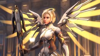 Mercy in Overwatch 2 standing still holding a staff