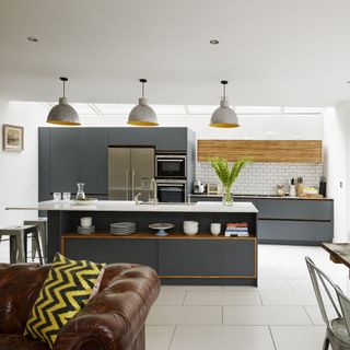 kitchen area with grey worktop and sofa