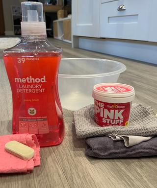 A collection of pink shoe cleaning materials