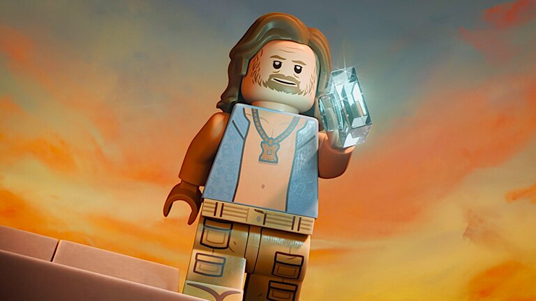 a Lego minifig of a blond bearded dude holding a sparkly stone