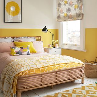 Yellow bedroom with half height yellow painted walls