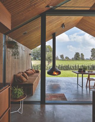 Contemporary Cheminee fire pit in a covered outdoor area