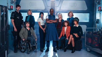 Alexander Devrient as Colonel Ibrahim, Ruth Madeley as Shirley, Jemma Redgrave as Kate Lethbridge Stewart, Varada Sethu as Belinda, Ncuti Gatwa as the Doctor, Millie Gibson as Ruby, Bonnie Langford as Mel, Susan Twist as Susan Triad, and Yasmin Finney as Rose Noble in Doctor Who: 'The Reality War.'