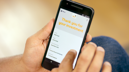 Person using NS&I app on smartphone