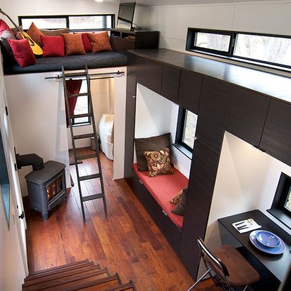 cabin with high end appliances cabinetry furniture and fixtures