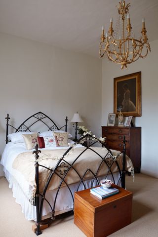 ornate bedframe in manor bedroom