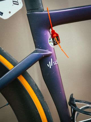 Lotte Kopecky's S-Works Tarmac SL7 close up with UCI orange check tag