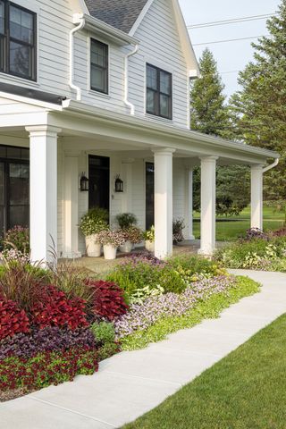 front porch surrounded by gardens