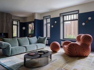 blue painted living room with Gaetano Pesce’s Up Chair