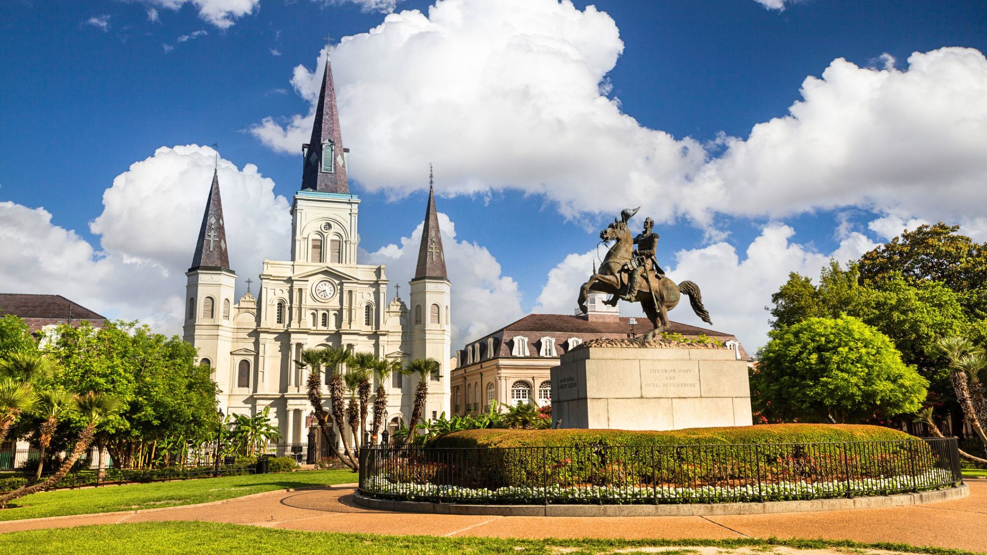 A shot of Andrew Jackson on his horse raring up in Jackson Square in New Orleans with St. Louis Cathedral in the background.