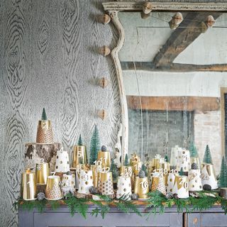 DIY Advent calendar white and gold cup on old dresser in front of vintage mirror