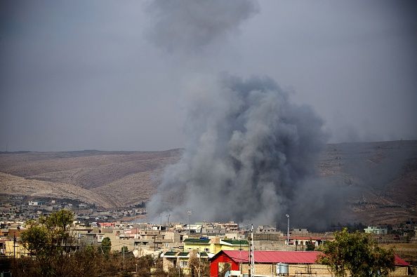 An air strike hits a target near Mosul, Iraq.