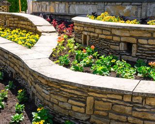 stone retaining wall with planting